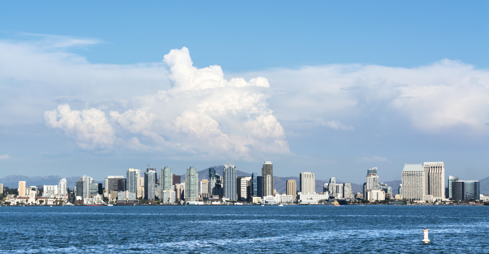 A shoreline, panoramic view of downtown San Diego, California shot from the harbor.